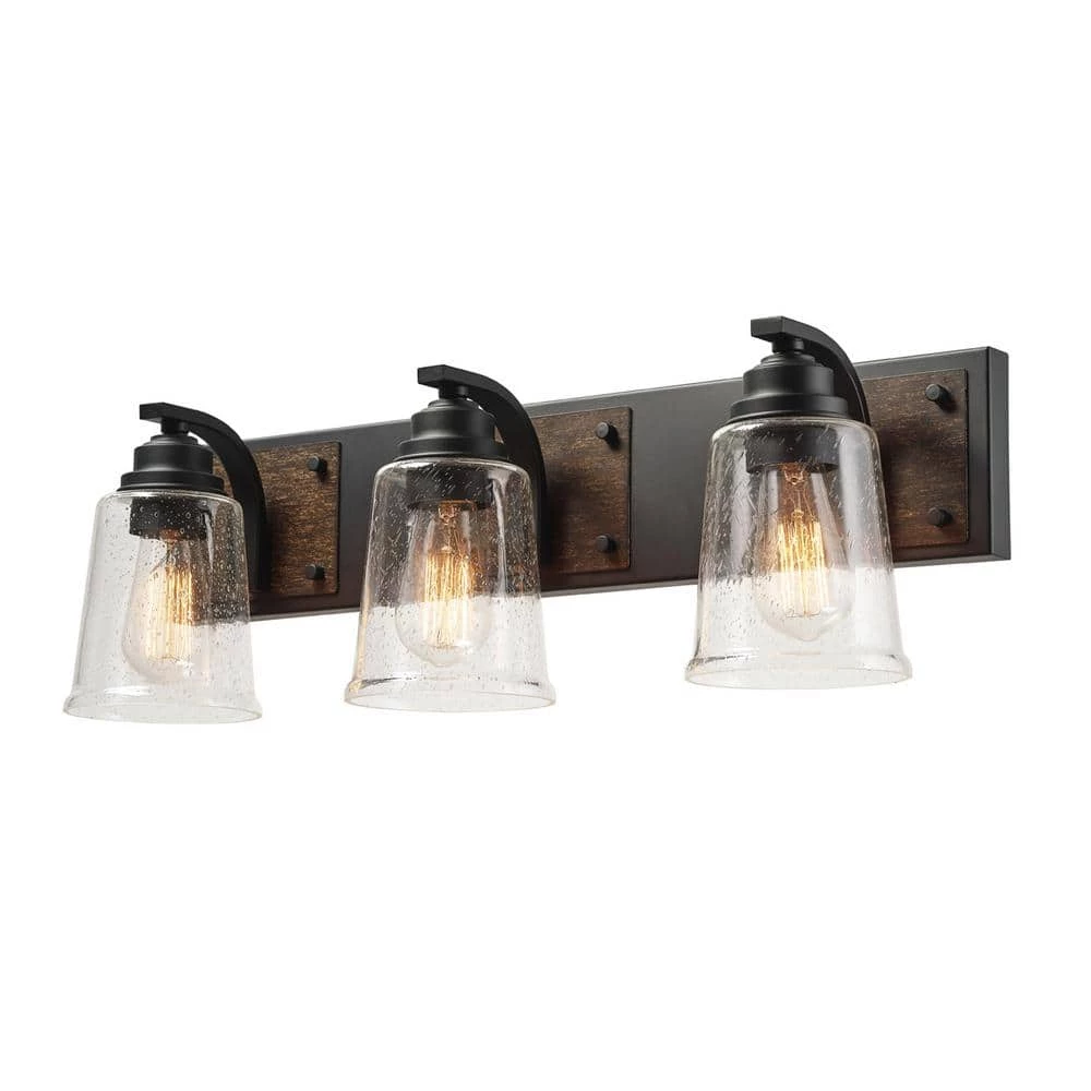 Warsaw 24 in. 3-Light Matte Black Vanity Light with Faux Wood Accents and Clear Seeded Glass Shades by Globe Electric 4 Warsaw 24 in. 3-Light Matte Black Vanity Light with Faux Wood Accents and Clear Seeded Glass Shades by Globe Electric - Image 4