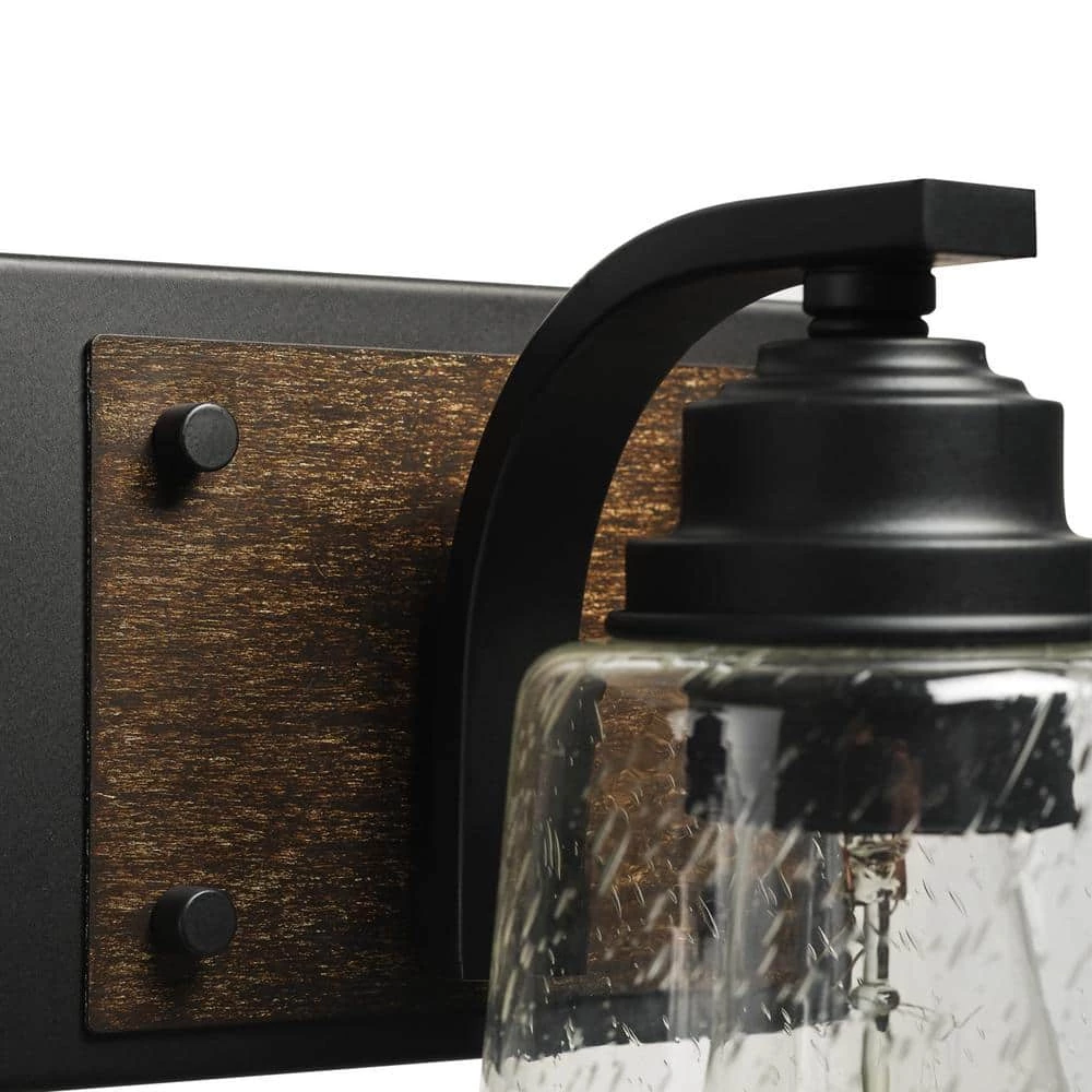Warsaw 24 in. 3-Light Matte Black Vanity Light with Faux Wood Accents and Clear Seeded Glass Shades by Globe Electric 3 Warsaw 24 in. 3-Light Matte Black Vanity Light with Faux Wood Accents and Clear Seeded Glass Shades by Globe Electric - Image 3