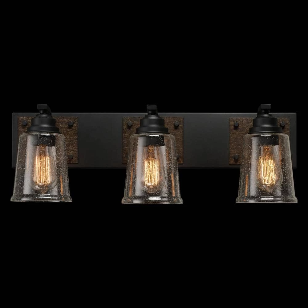 Warsaw 24 in. 3-Light Matte Black Vanity Light with Faux Wood Accents and Clear Seeded Glass Shades by Globe Electric 2 Warsaw 24 in. 3-Light Matte Black Vanity Light with Faux Wood Accents and Clear Seeded Glass Shades by Globe Electric - Image 2